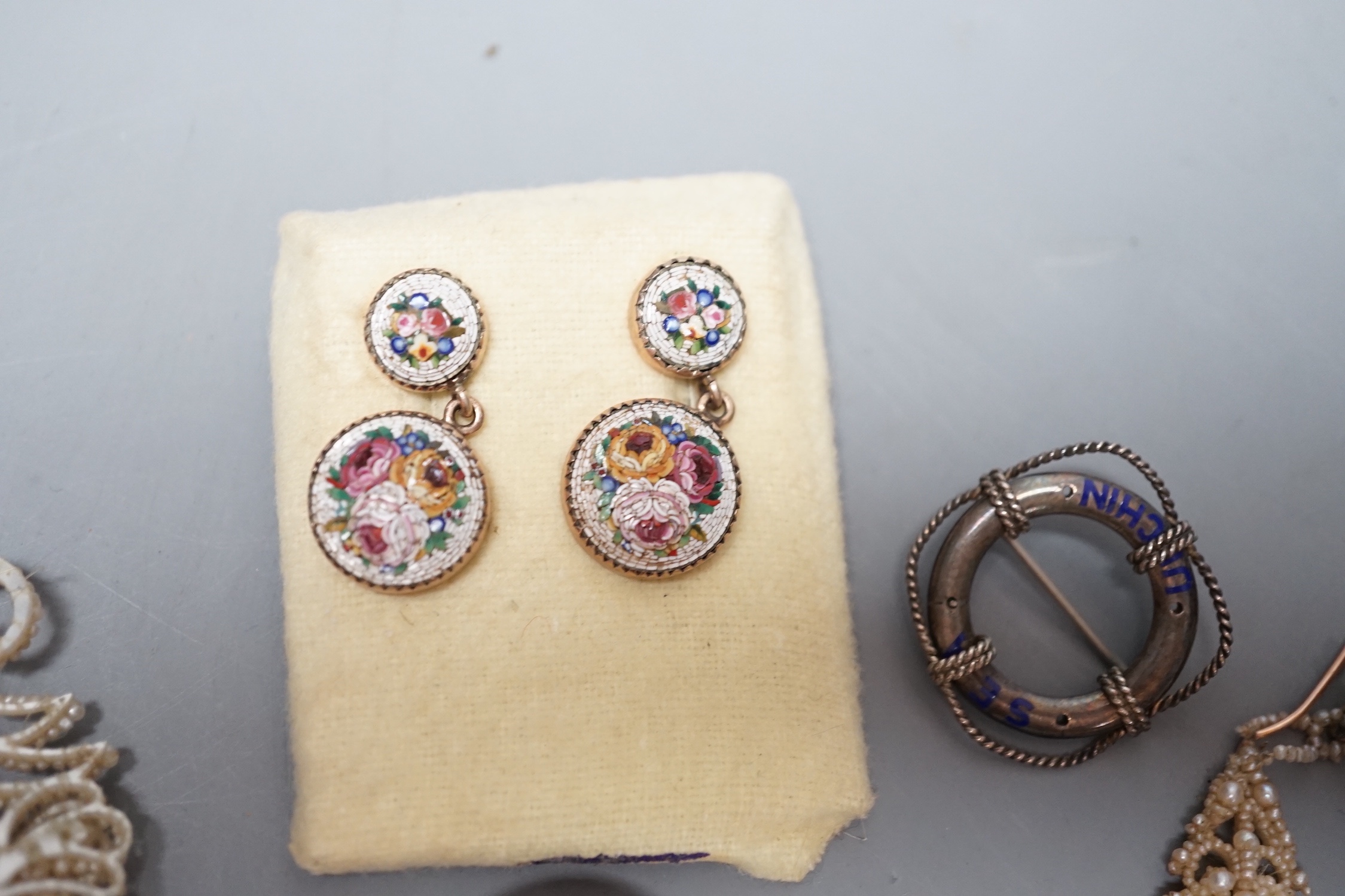 A suite of yellow metal and micro mosaic jewellery comprising a brooch, 72mm and pair of earrings, five items of seed pearl jewellery and a brooch.